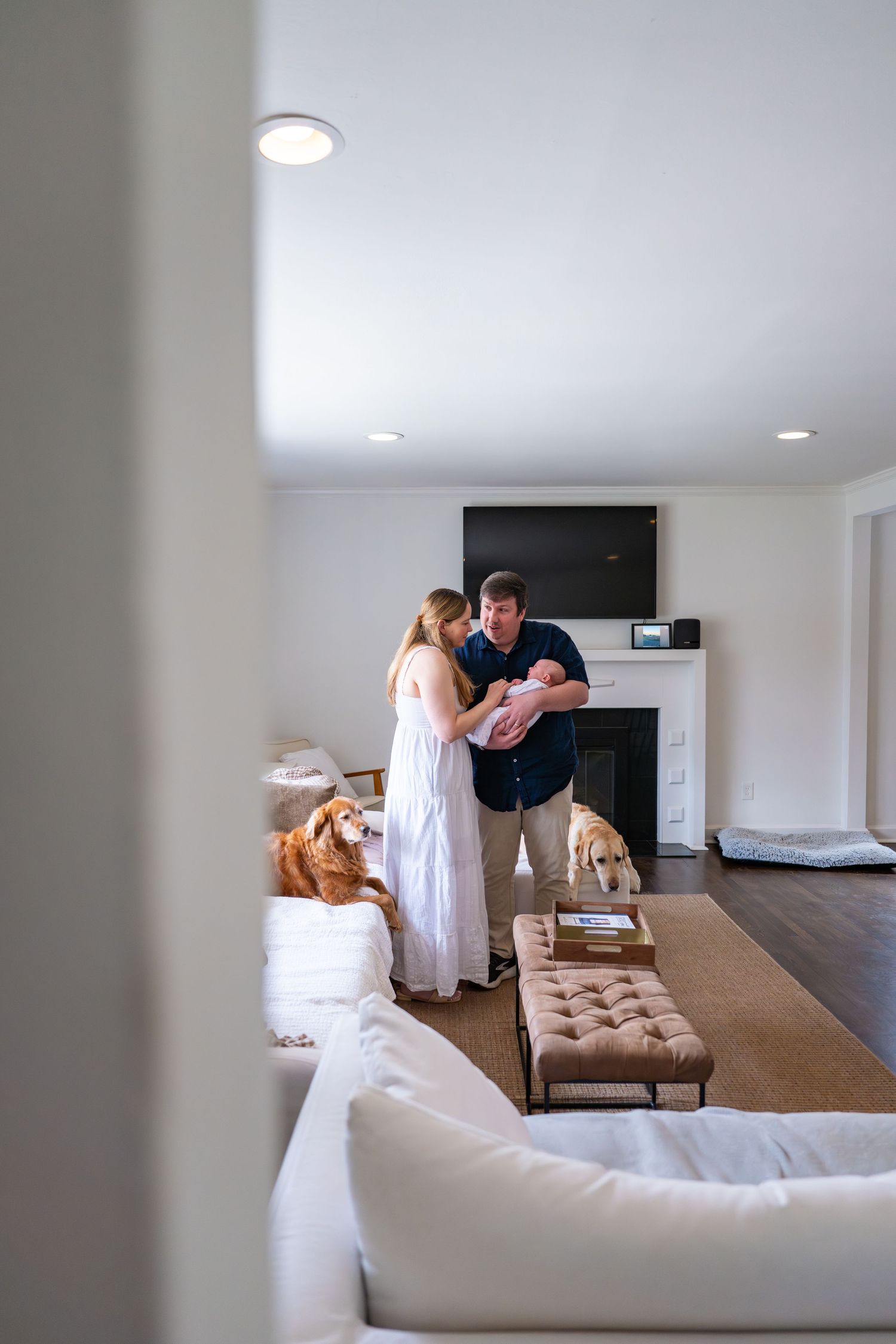 A sequence of six photos showing people in white attire interacting in a modern minimalist living room interior.
