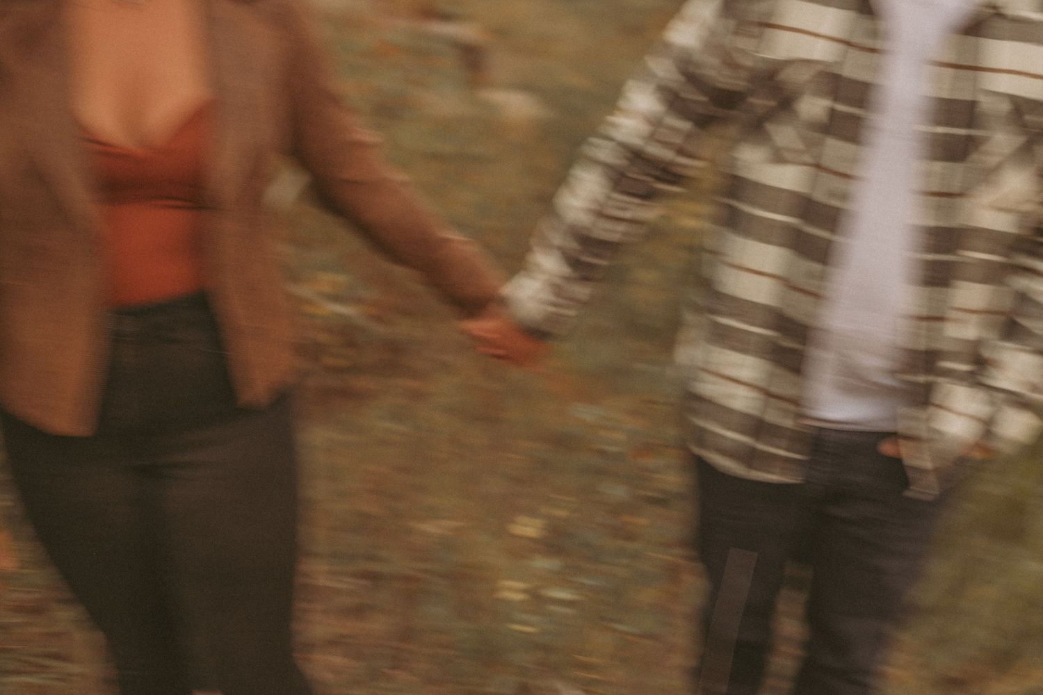 A couple holding hands, photographed by Kristy Baker Photography in Steamboat Springs, Colorado.