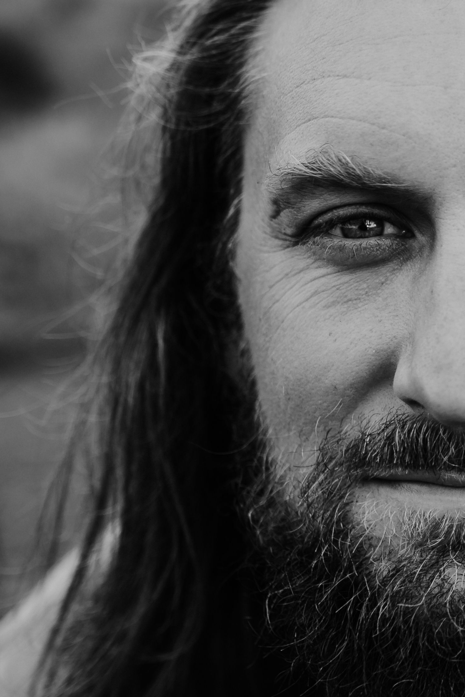 A man looking into the camera lens, photographed by Kristy Baker Photography in Steamboat Springs, Colorado.