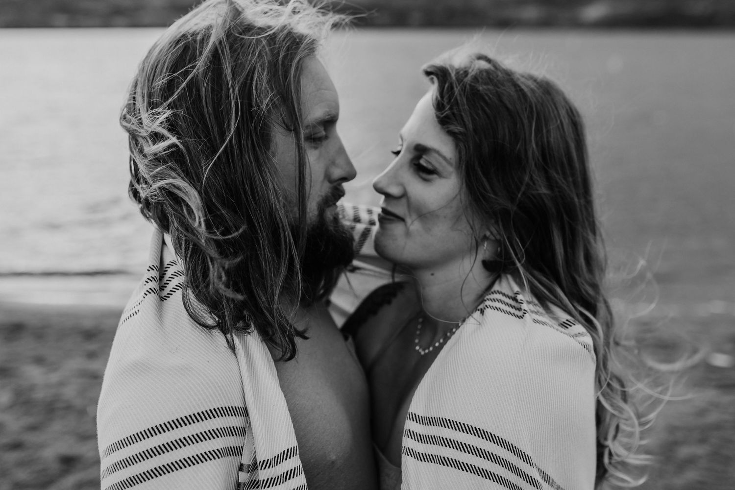 A couple looking deeply into each others eyes, photographed by Kristy Baker Photography in Steamboat Springs, Colorado.