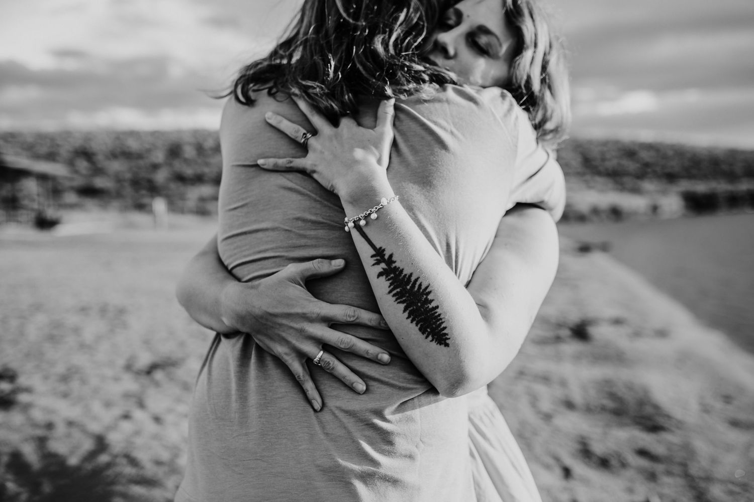 A couple embrace each other with a big hug, photographed by Kristy Baker Photography in Steamboat Springs, Colorado.