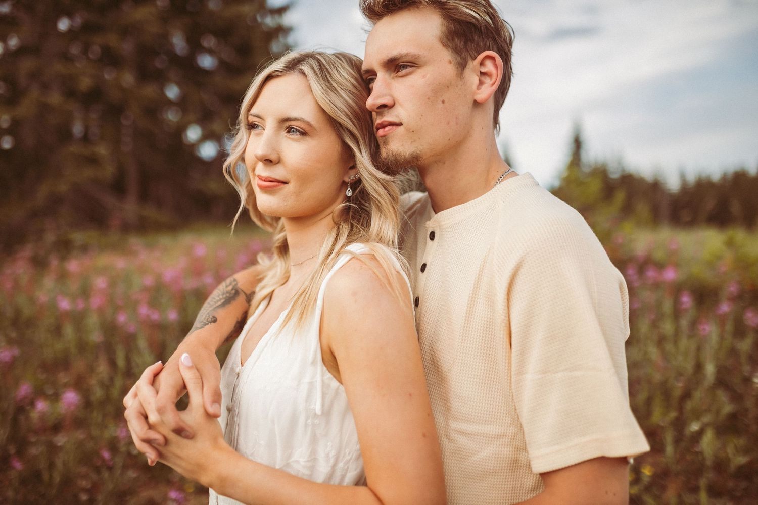 A couple standing together and looking out away from the camera, photographed by Kristy Baker Photography in Steamboat Springs, Colorado.