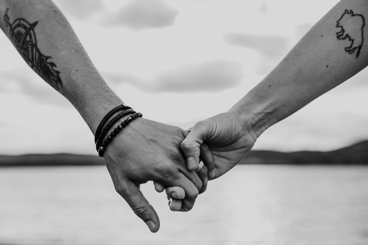 A couple holds hands with each other, photographed by Kristy Baker Photography in Steamboat Springs, Colorado.