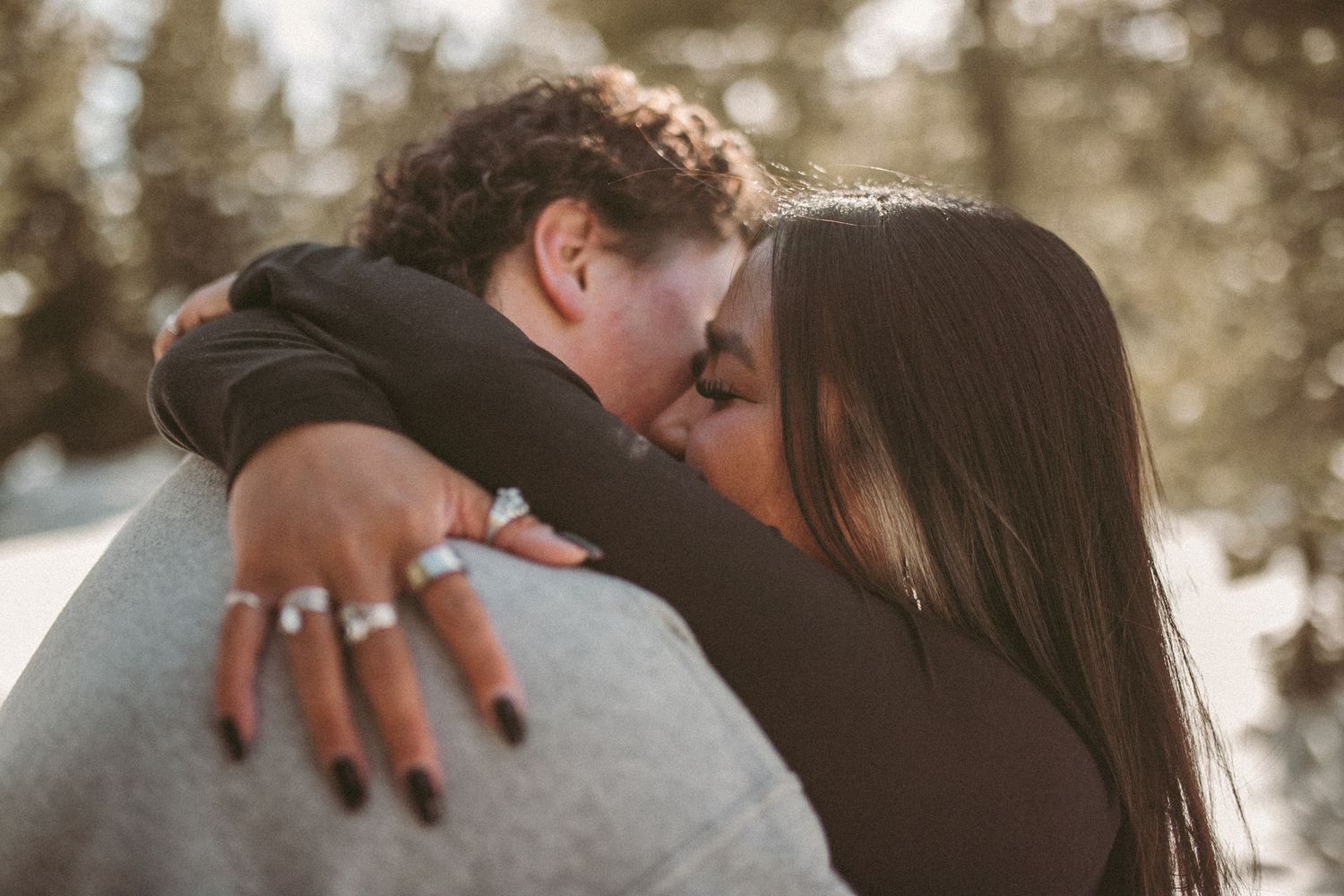 A couple giving each other a big embrace, photographed by Kristy Baker Photography in Steamboat Springs, Colorado.