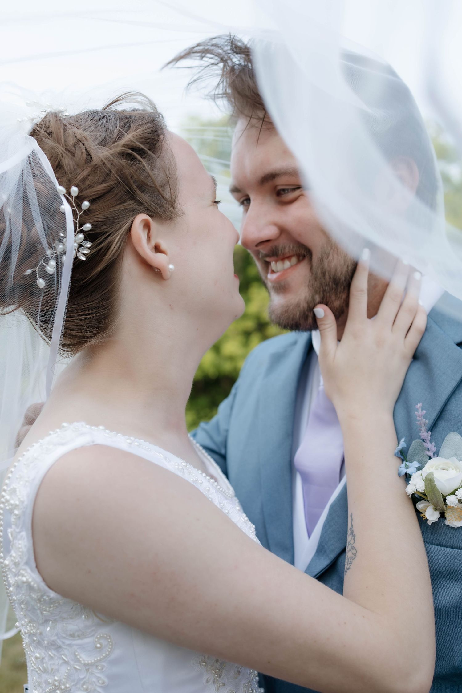 Romantic couple portrait outside family church in Oklahoma, taken by professional Oklahoma wedding photographer