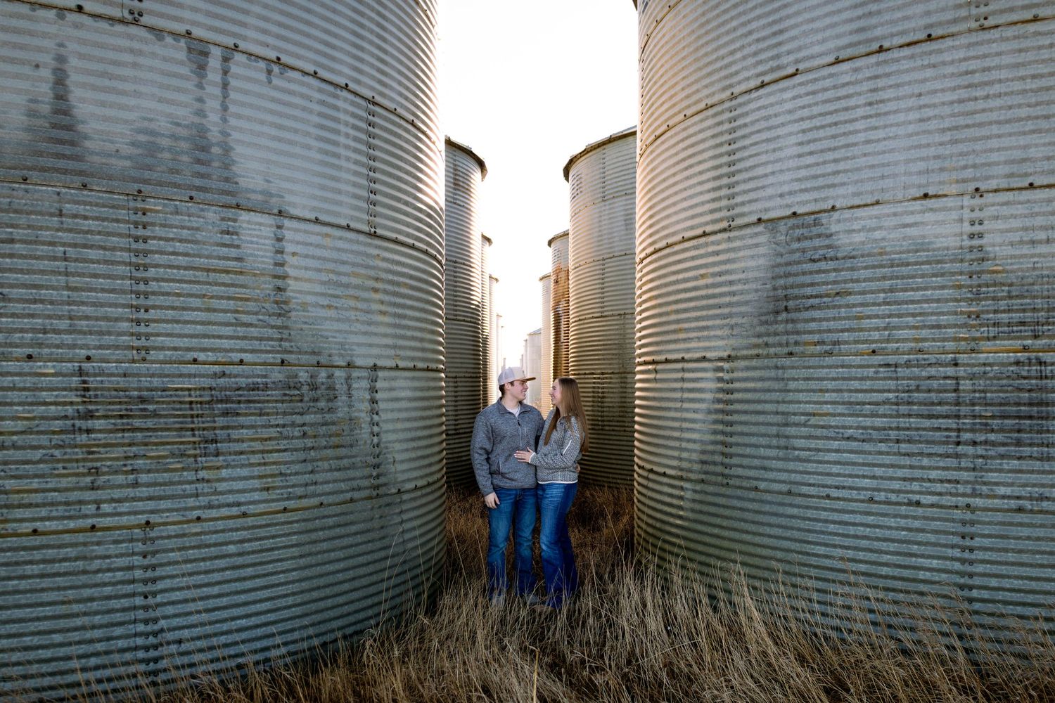 Dickinson photographer North Dakota couples photo featuring natural laughter and authentic moments in outdoor setting.