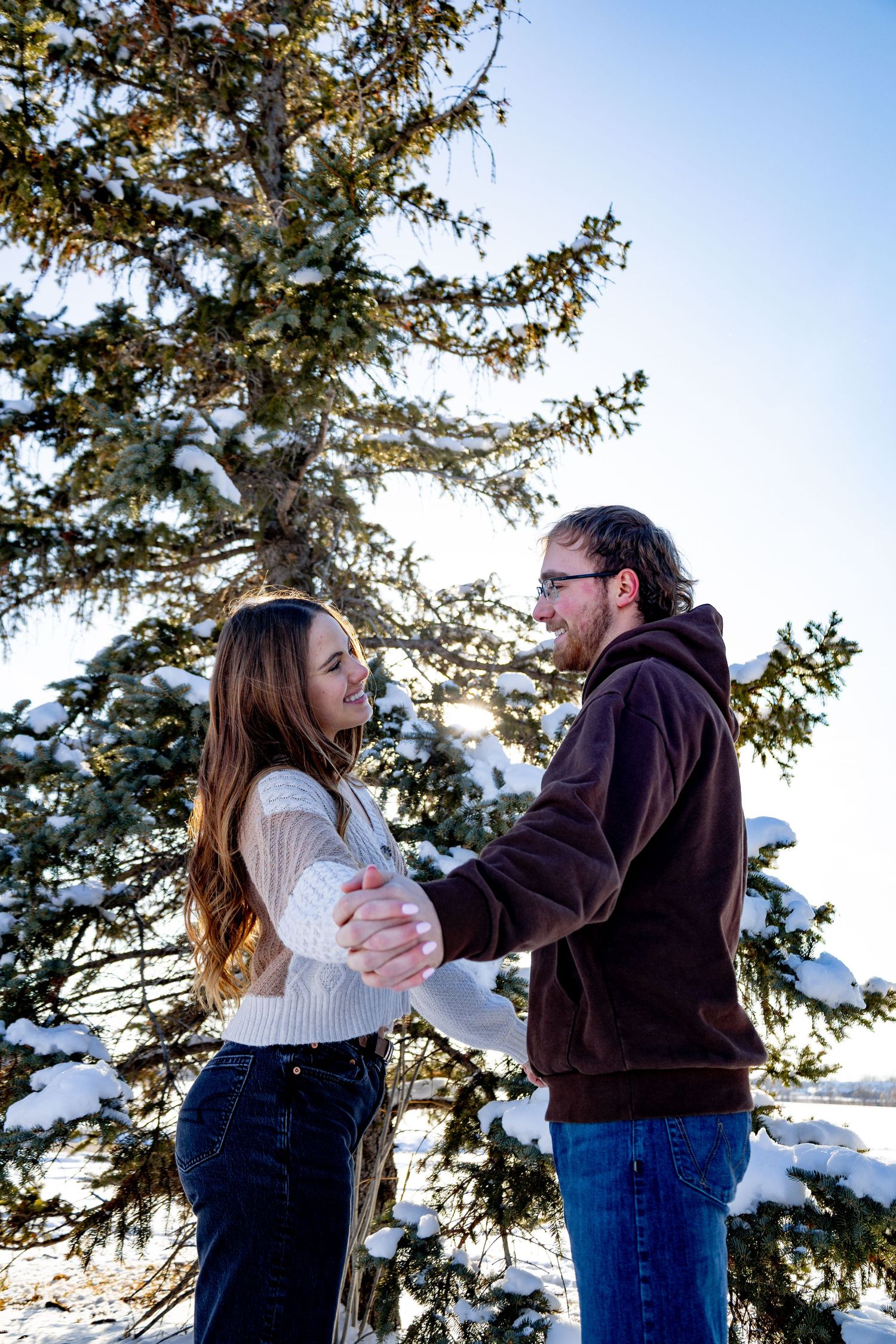 Anna Nasset North Dakota photographer documenting authentic couple connection in natural outdoor setting.