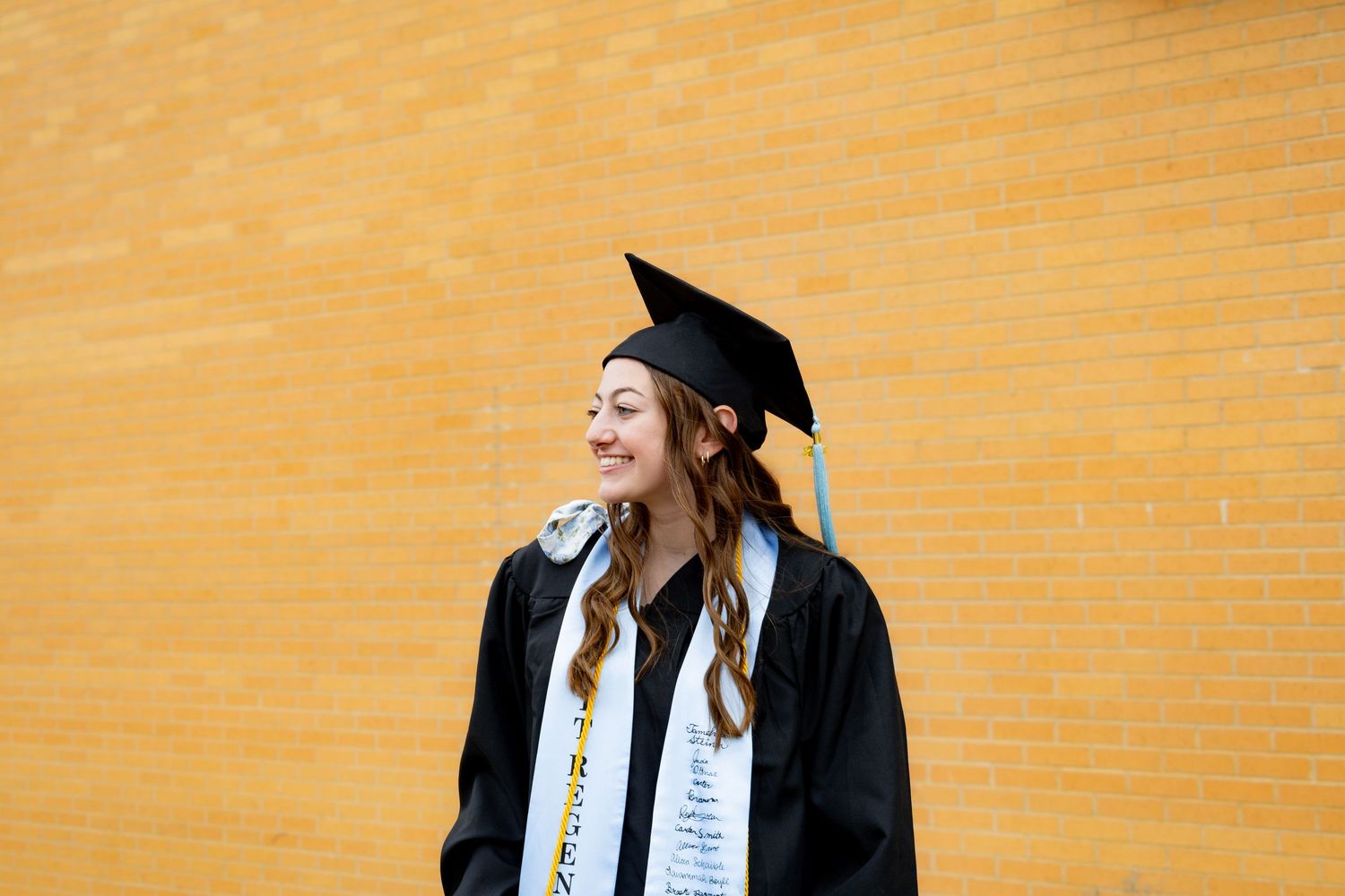 Dickinson photographer North Dakota senior portrait outdoors with relaxed posing, natural light, and authentic expression by Anna Nasset.