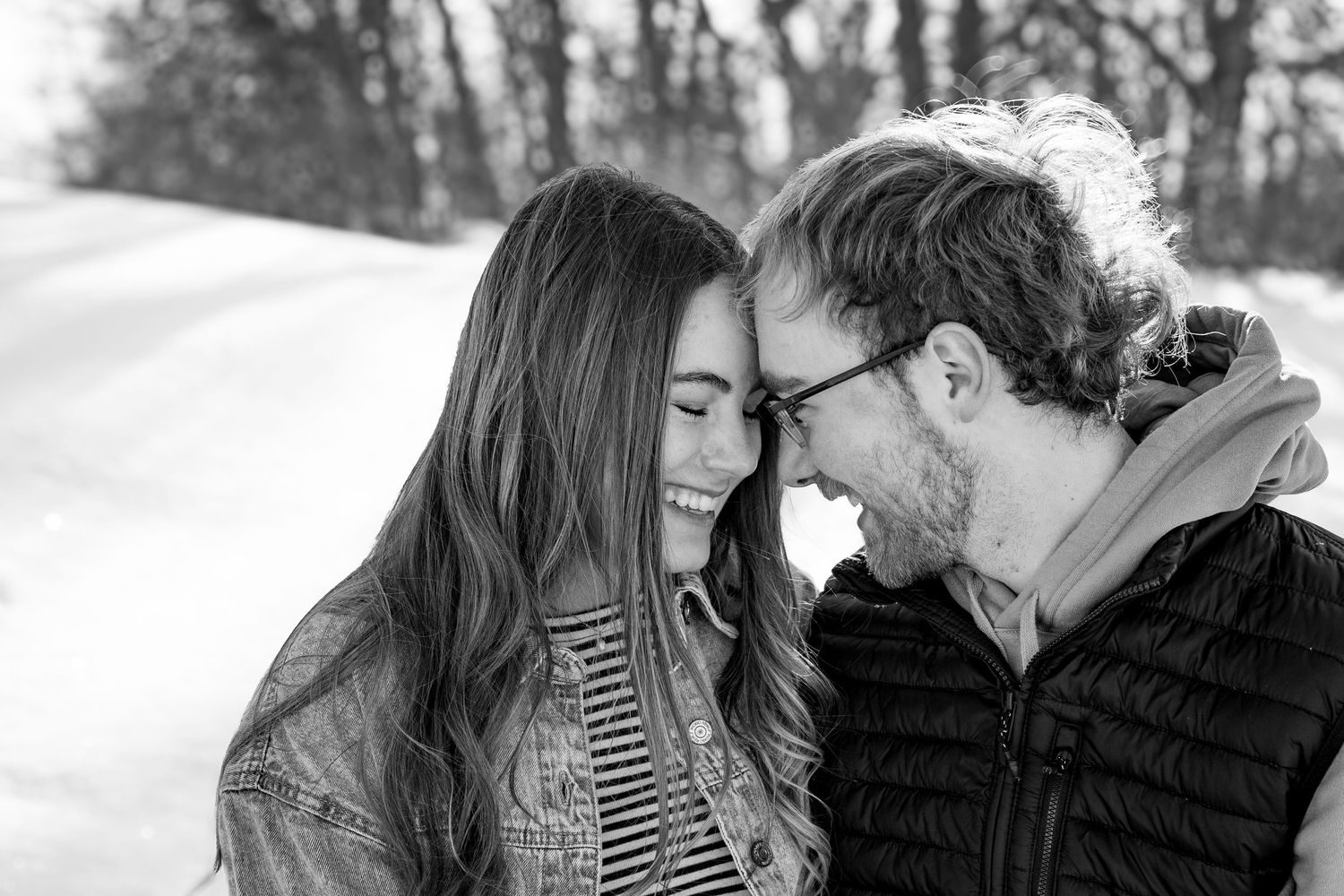 Anna Nasset Bismarck photographer capturing candid moment between couple in scenic North Dakota landscape.