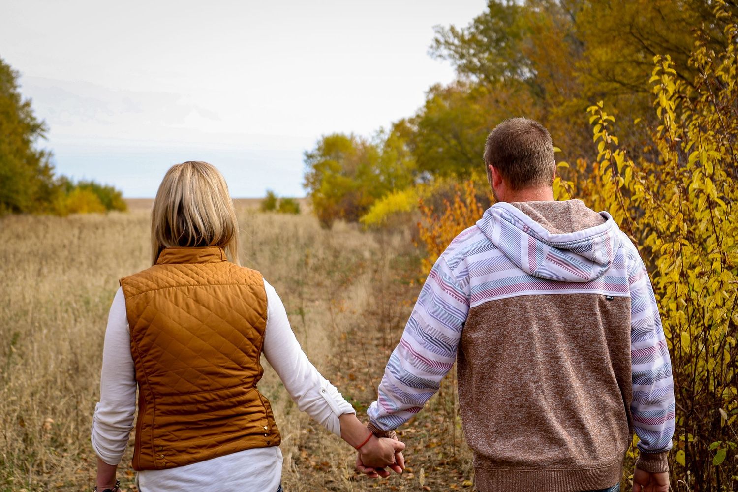 North Dakota family photographer capturing family portrait with candid interaction and professional branding style.