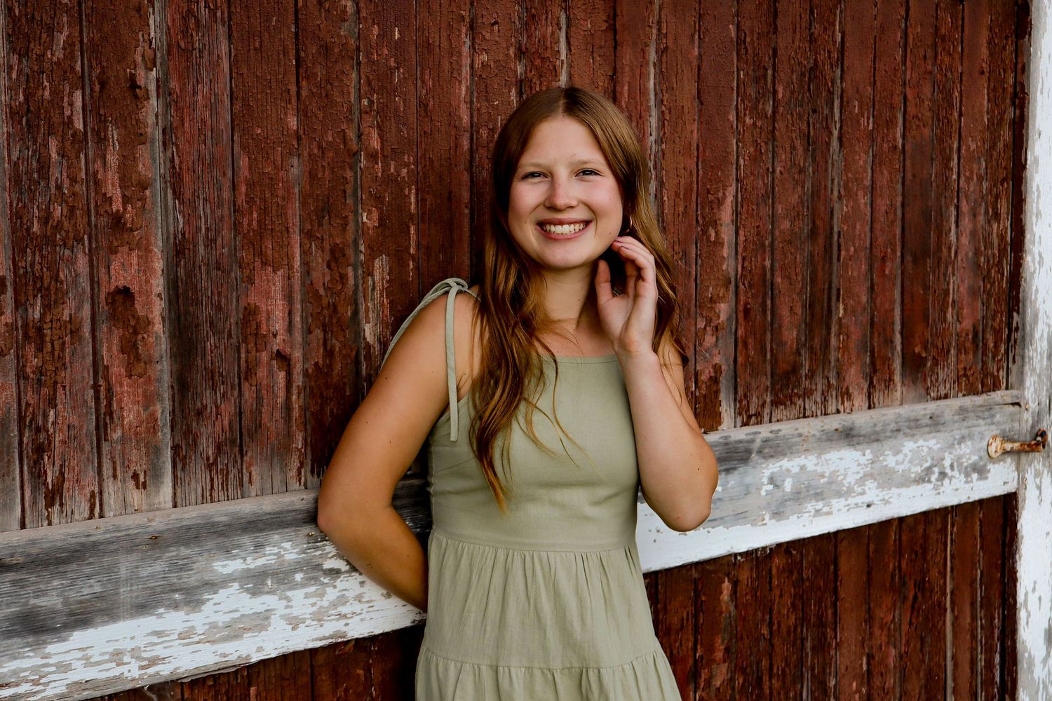 Bismarck photographer North Dakota senior portrait in wide open prairie with true-to-color editing and authentic candid moment.