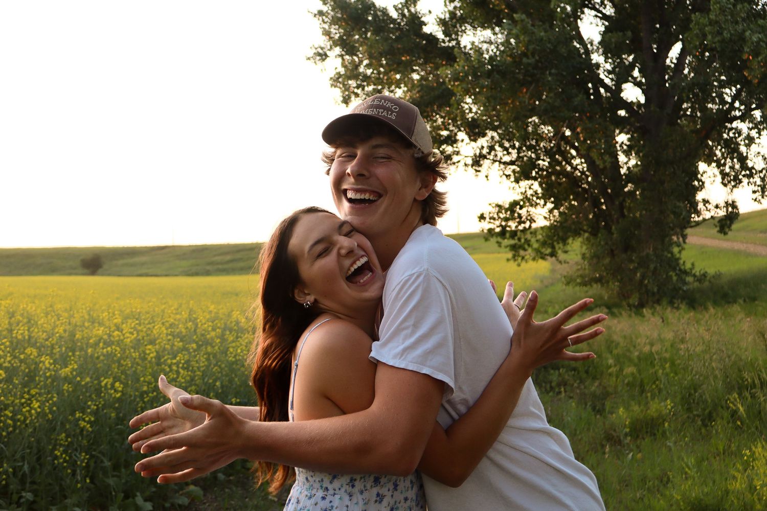 Dickinson photographer North Dakota capturing couple walking together with natural movement and true-to-color photography.
