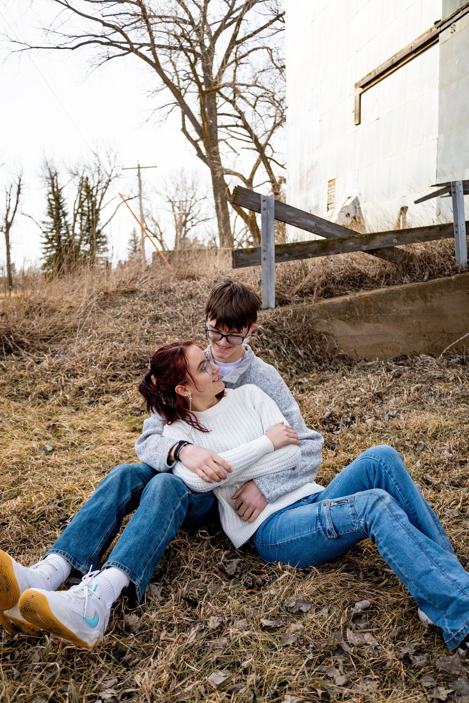 Dickinson photographer North Dakota documenting genuine laughter between couple during outdoor portrait experience.
