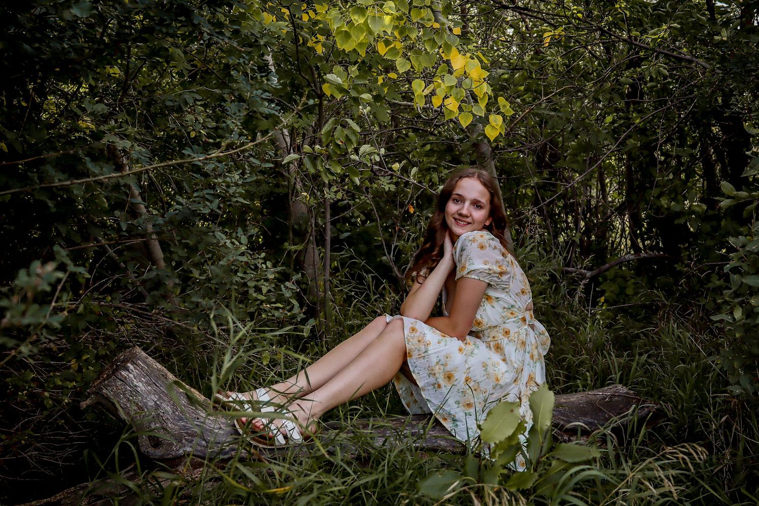 Bismarck photographer North Dakota capturing senior portrait with authentic smile and natural outdoor lighting.
