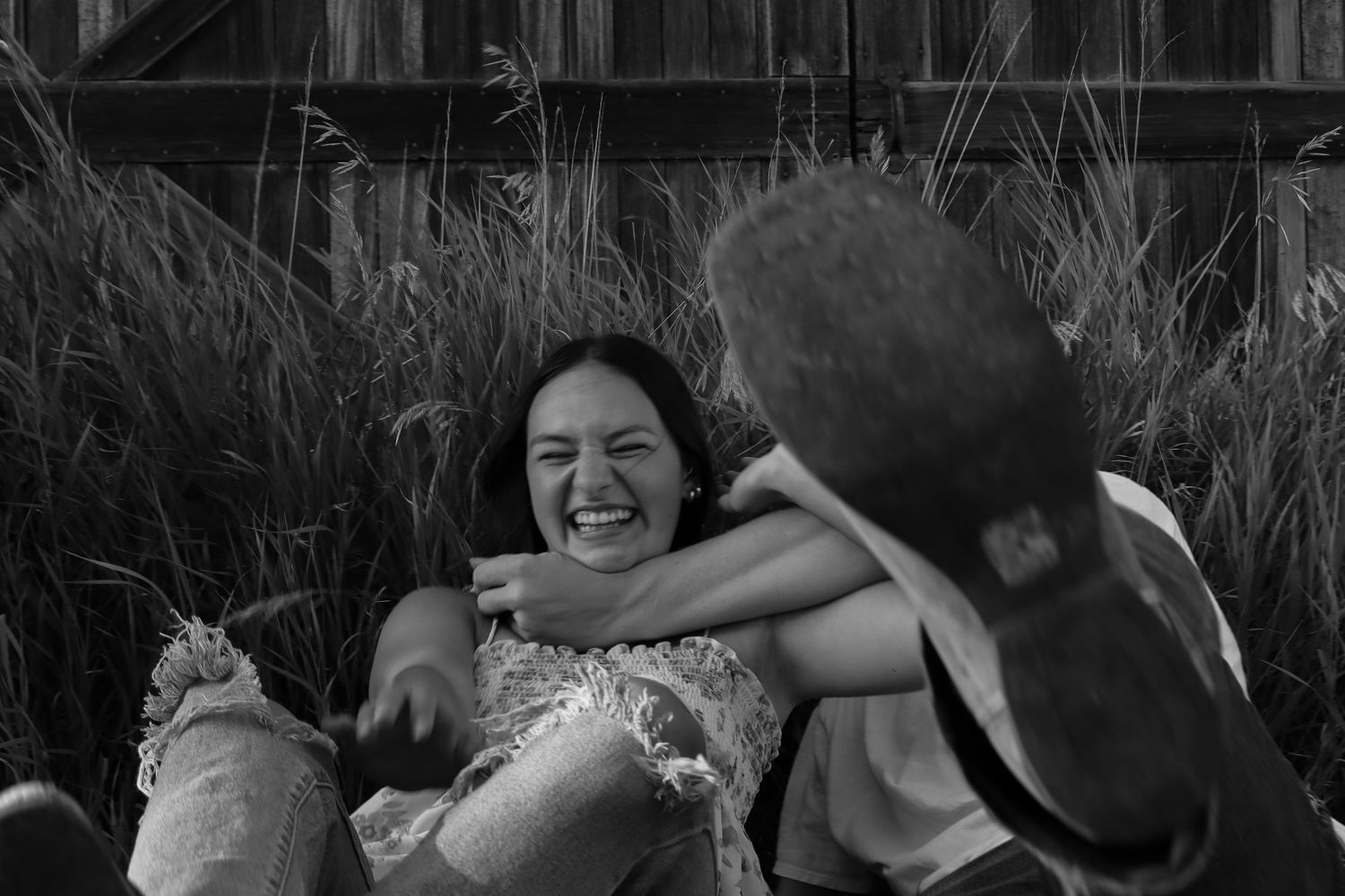 Prairie Glow Photography North Dakota couples photo with candid laughter, natural light, and authentic storytelling.