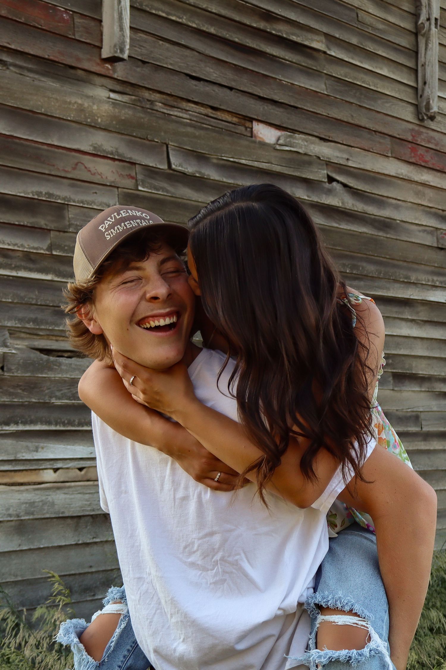 North Dakota couples portrait by Prairie Glow Photography featuring candid moments and warm natural light.
