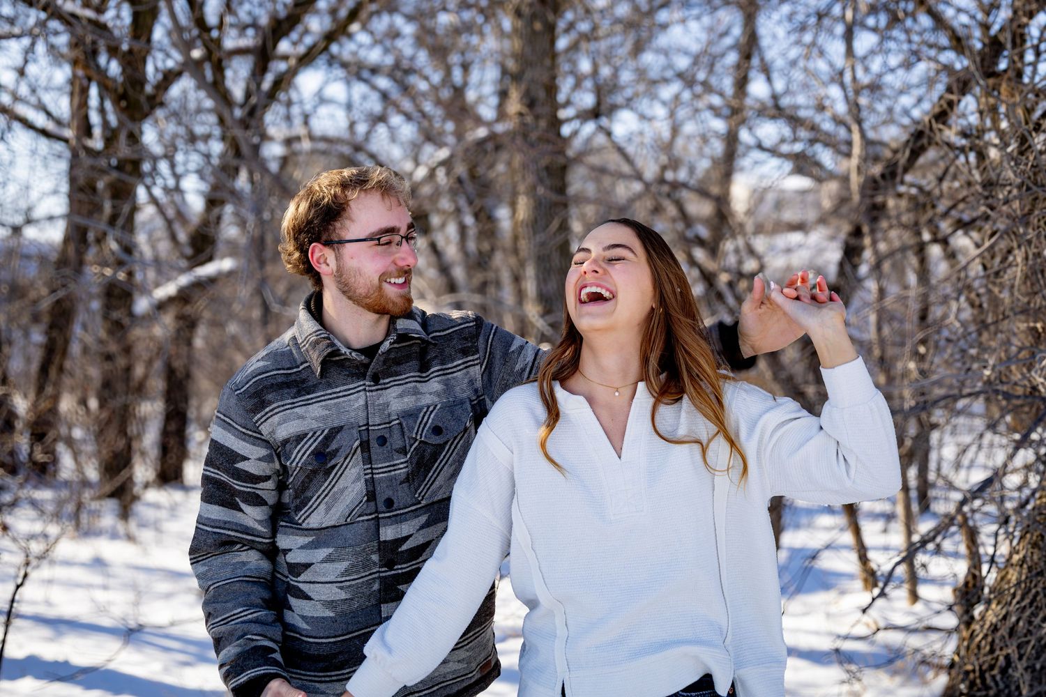 Anna Nasset North Dakota photographer capturing romantic couples portrait with candid interaction and genuine emotion.