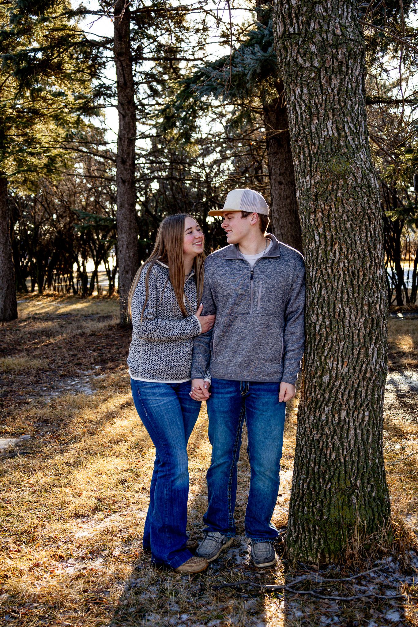 Bismarck photographer North Dakota documenting genuine couple connection in prairie landscape with timeless style.
