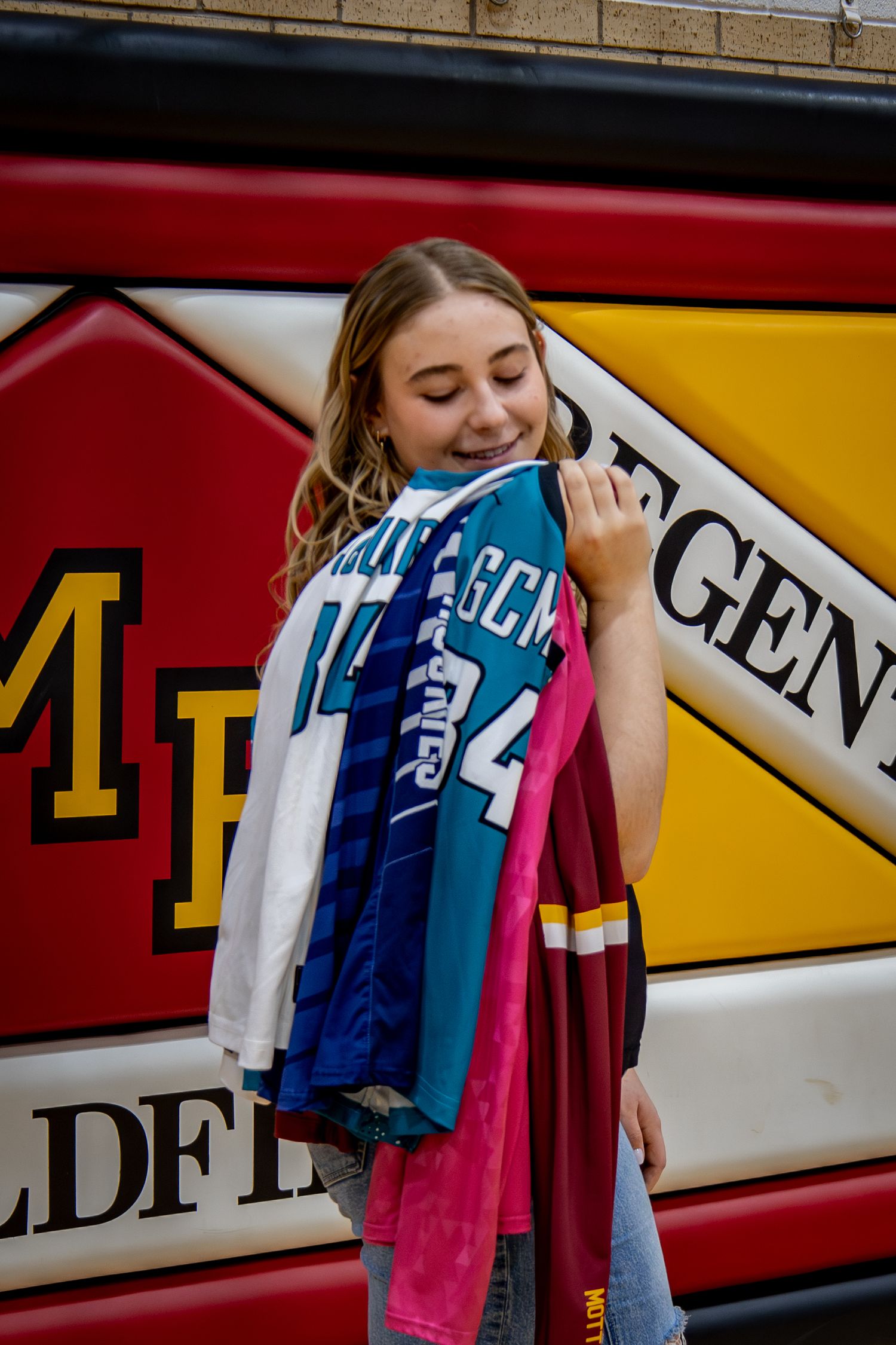 Dickinson photographer North Dakota capturing senior portrait with relaxed movement and authentic expression.