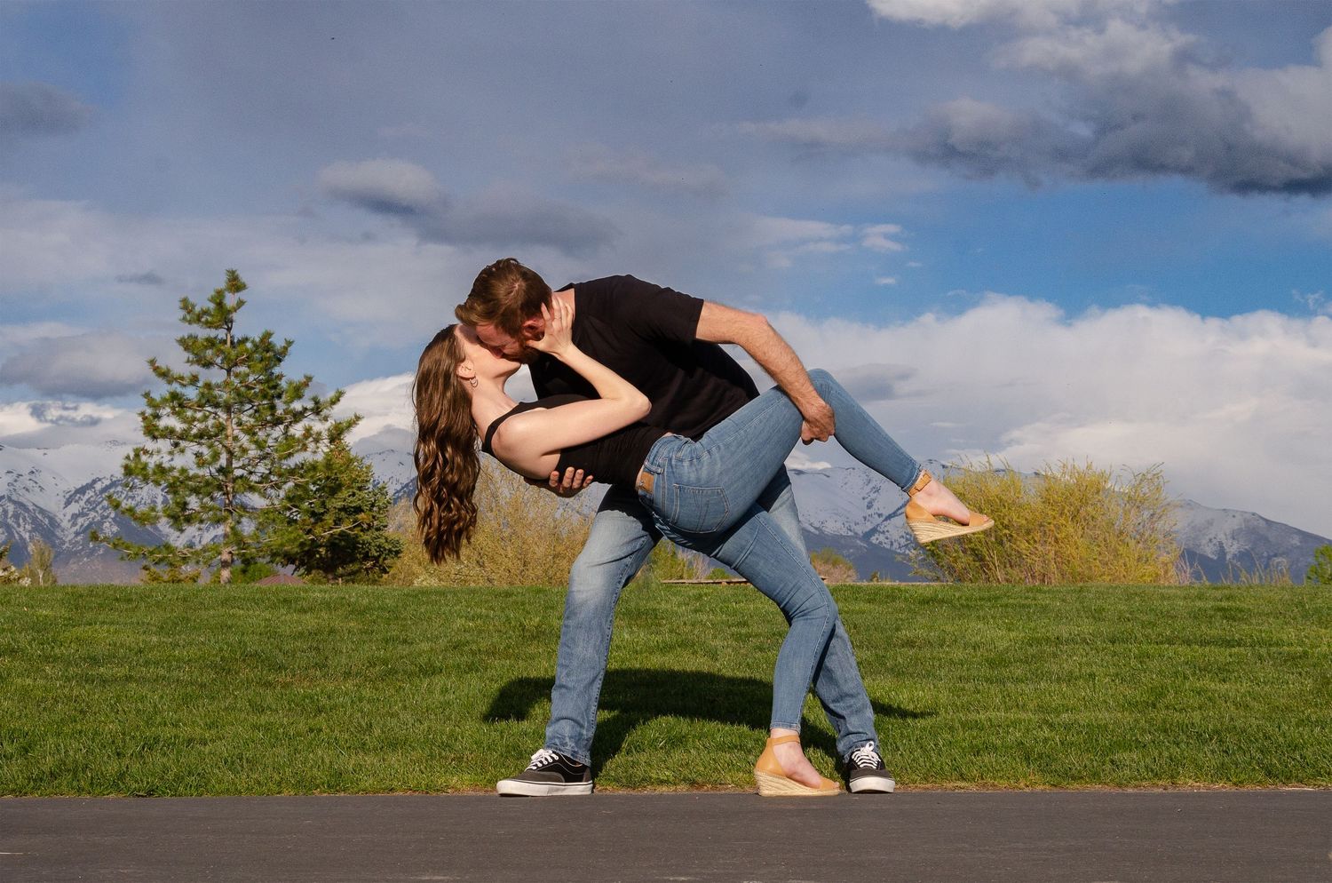 Romantic engagement photos of a couple outdoors in Northern Utah capturing natural, candid moments and timeless love story photography