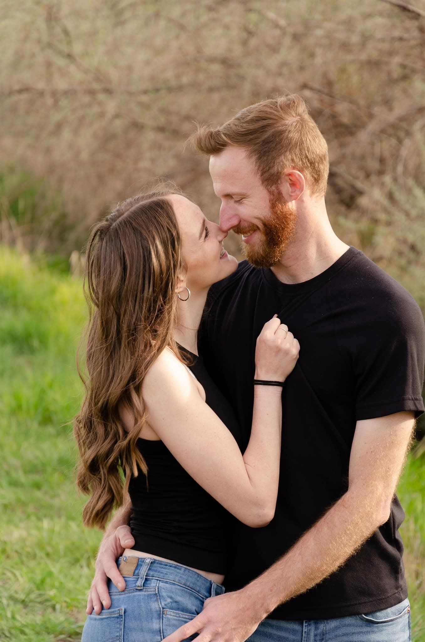 Engagement photos in Northern Utah with couple embracing in scenic location