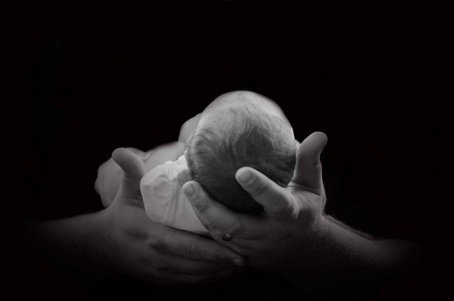 Northern Utah newborn photographer capturing sleeping newborn in cozy indoor session
