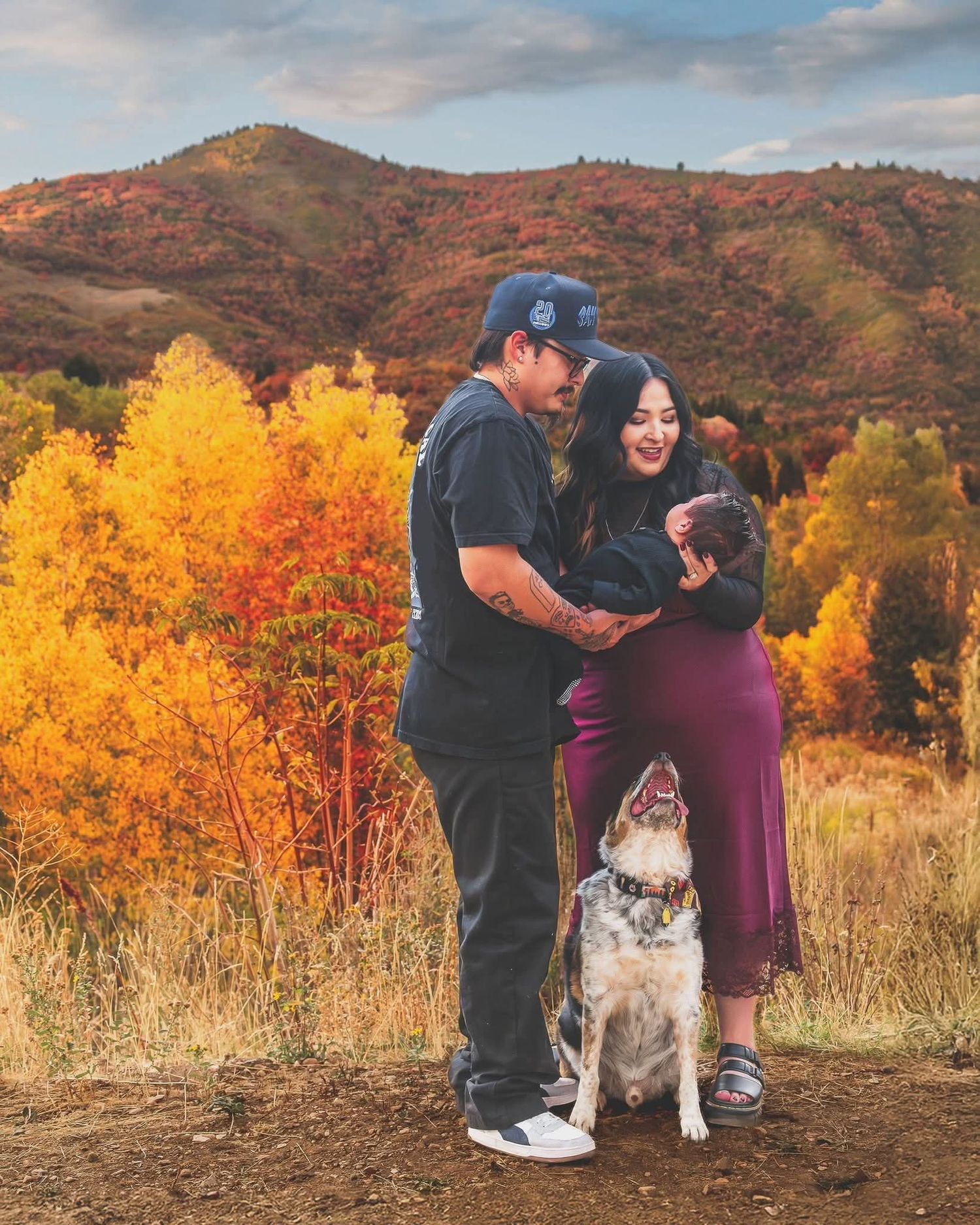 Northern Utah couples photographer capturing couple with dog in scenic mountain fall portrait session