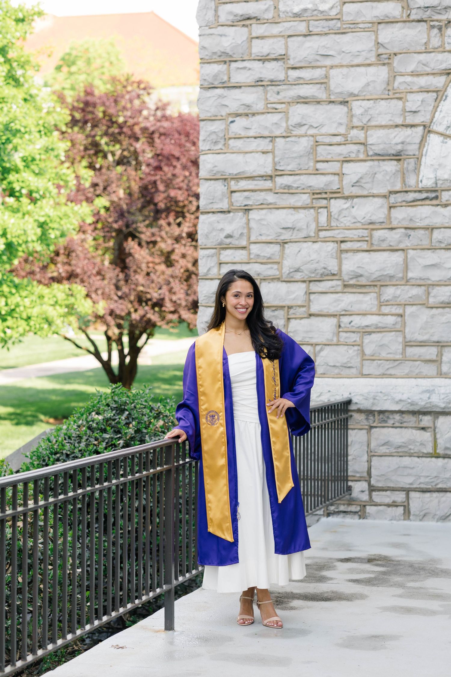 An image of a graduate from James Madison University on campus in Harrisonburg, Virginia.