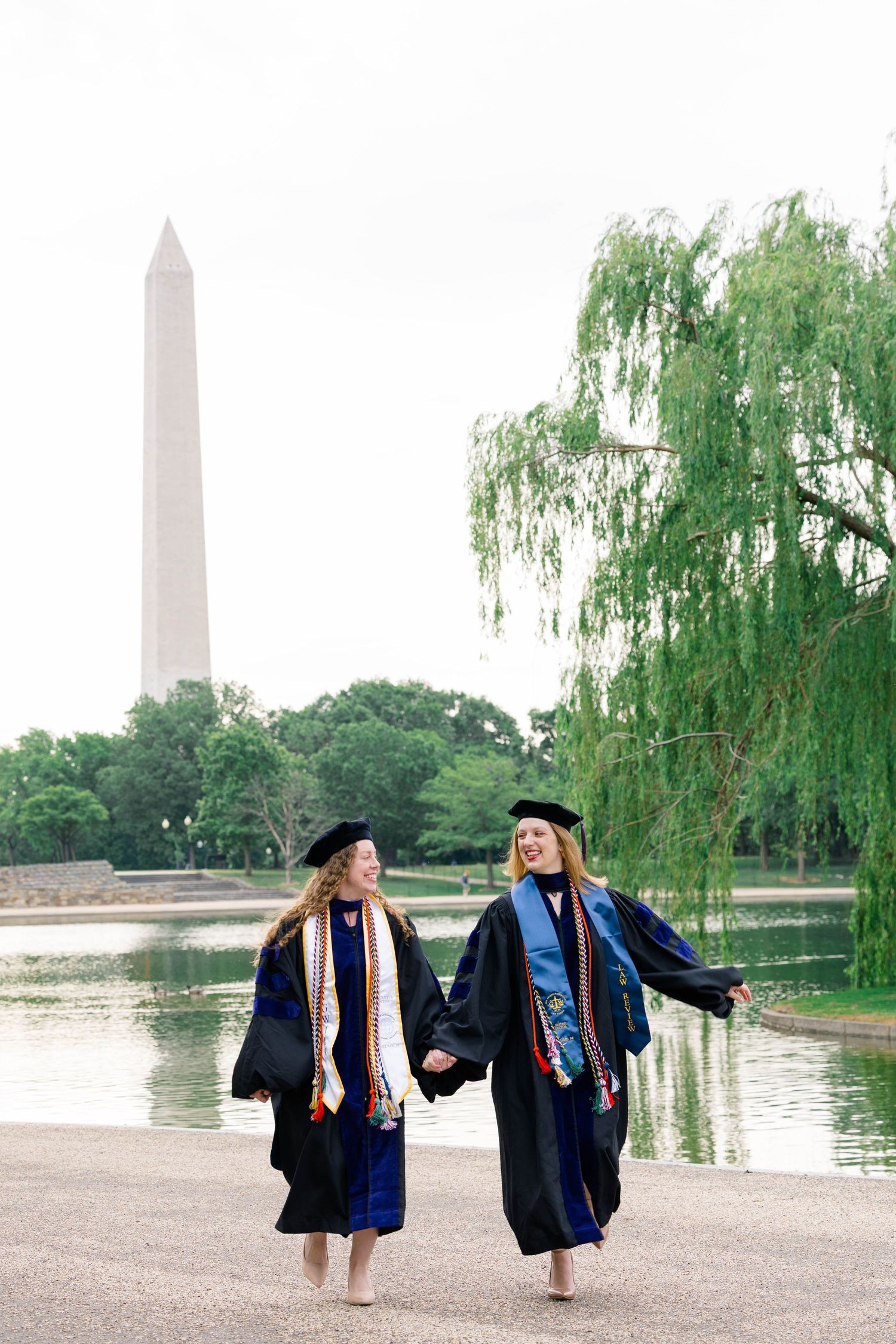 An image of two graduates in Washington, D.C.