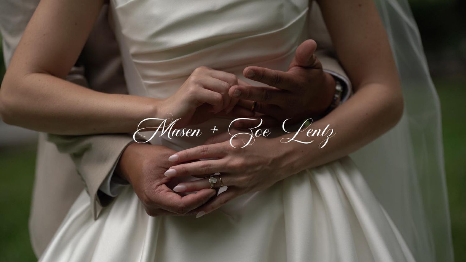 Close-up of Mason and Zoe Lentz holding hands in wedding attire, showcasing their wedding rings on their special day.