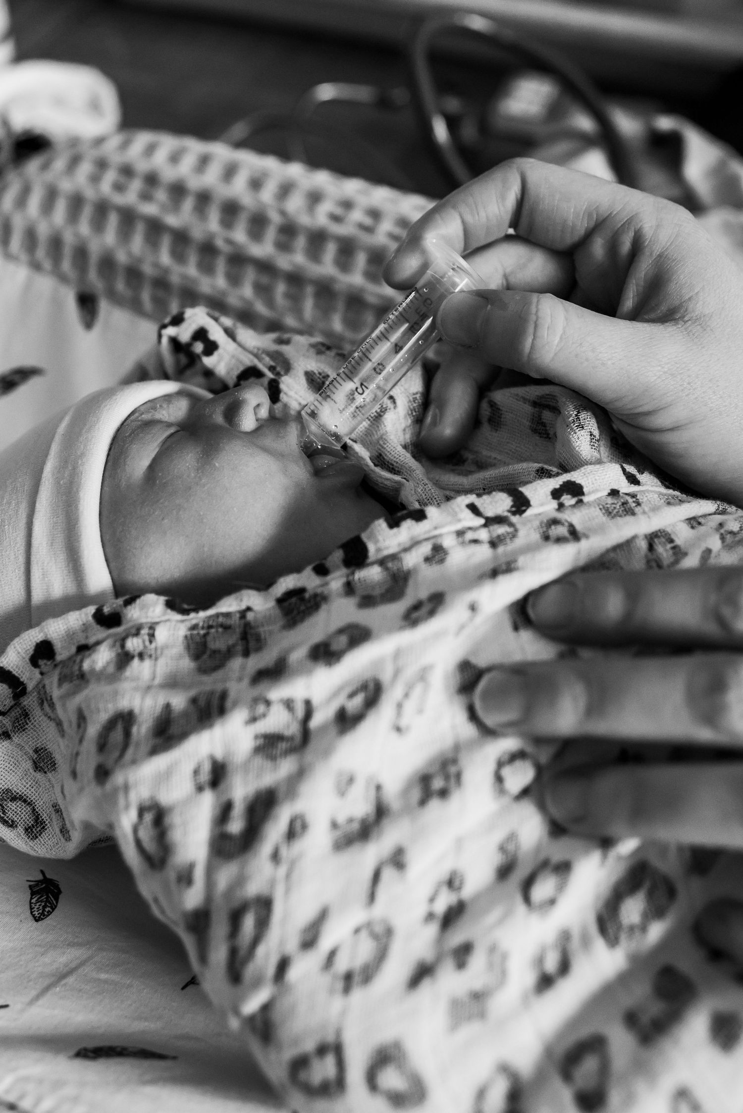 Black and white photo of a premature newborn baby receiving medical care. Lelystad, Almere, Dronten, Flevoland