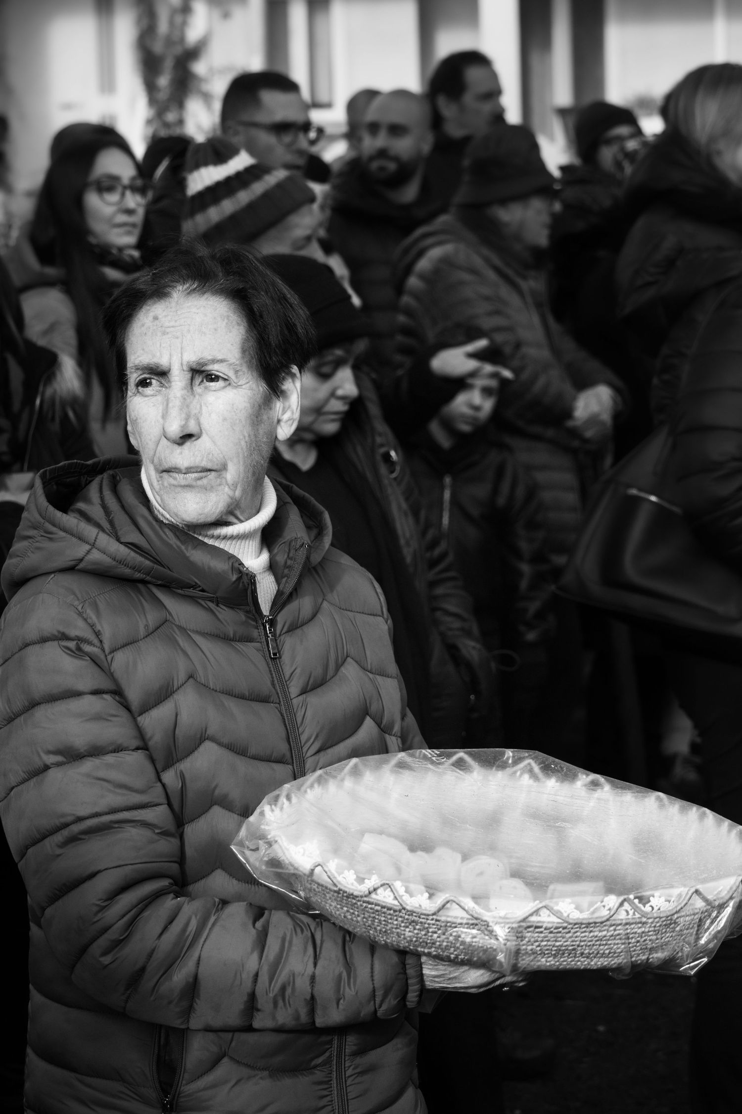 Traditional Mamuthones and Issohadores masks around the fire in Mamoiada, Sardinia - Black and white reportage by Marco Eretta