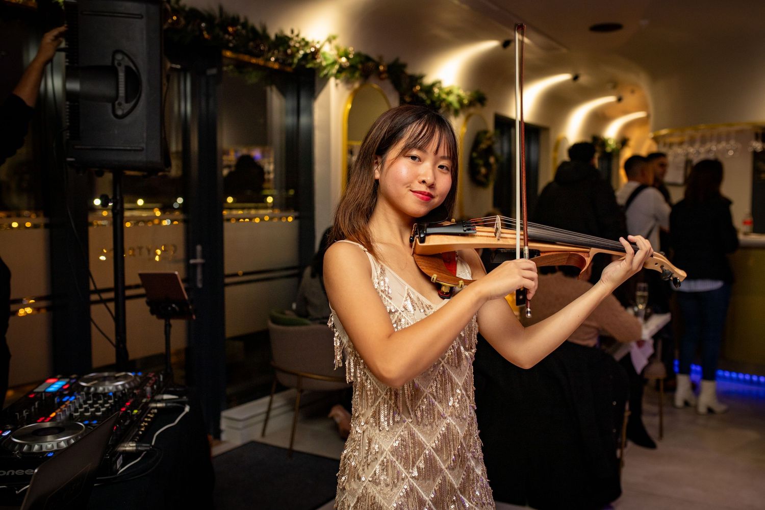 Live violin performance during restaurant grand opening event entertainment in Heathrow, London, UK