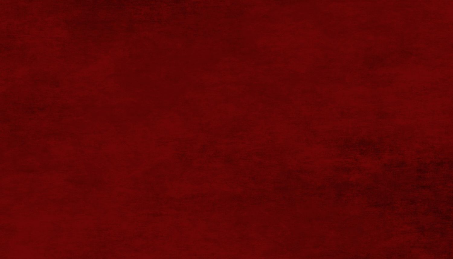 Rich deep red velvet texture background with dark grunge overlay, perfect for luxury design projects.