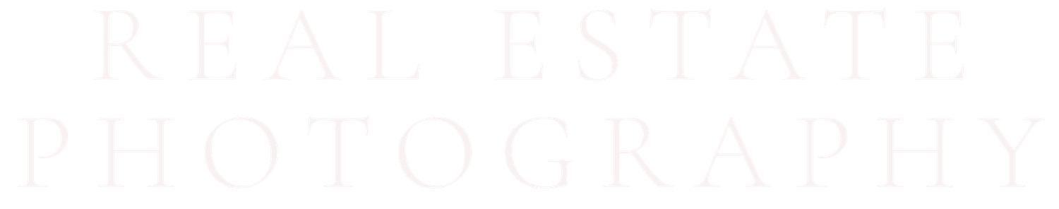 Real estate photography text logo in subtle light gray serif font on clean white background.