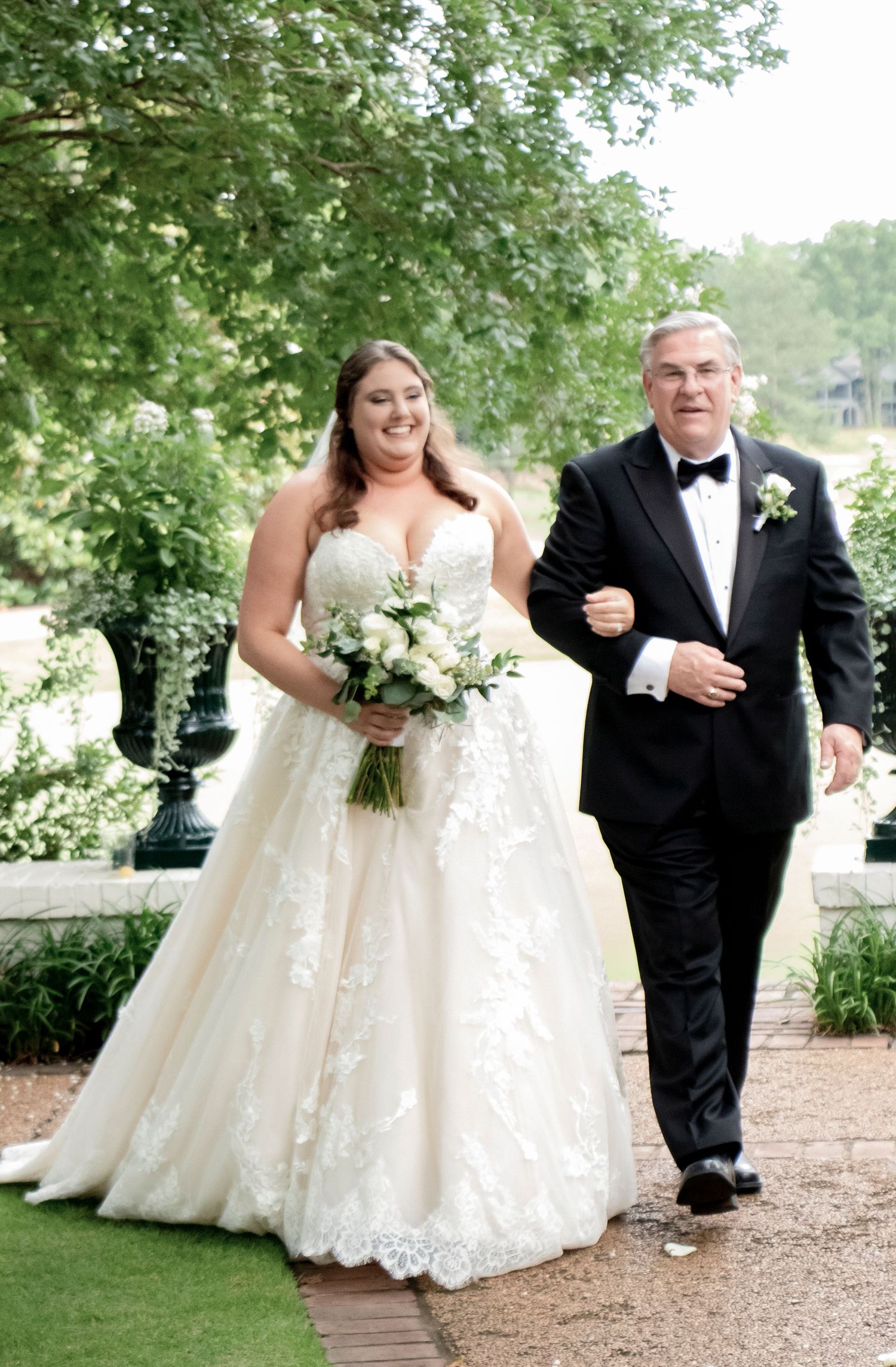 a daddy walking his little girl down the aisle