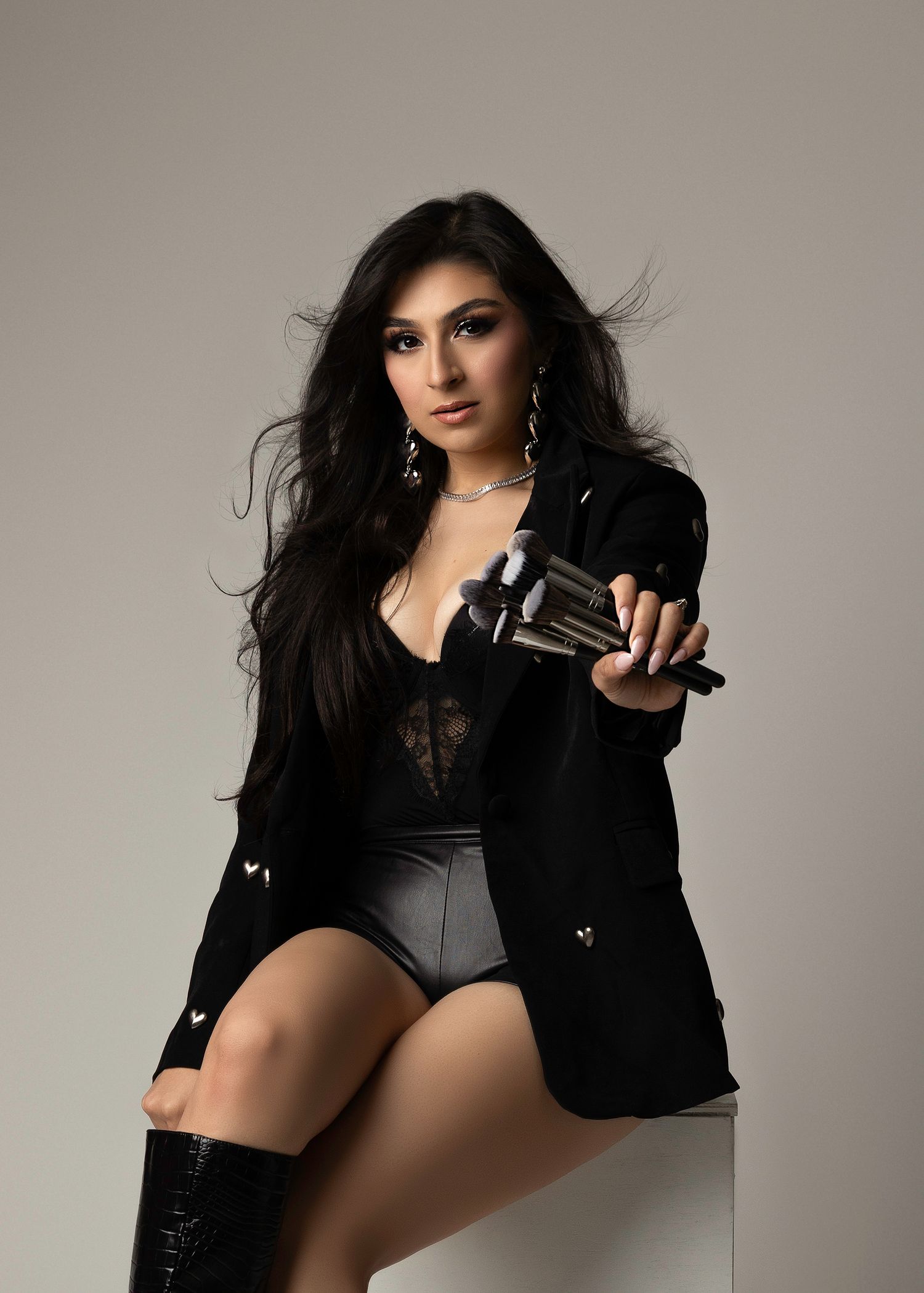 Fashion portrait series in black outfit against neutral studio background for makeup artist. Photographer located in Southern California.