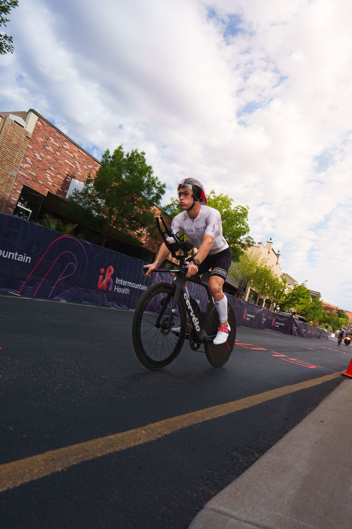 A triathlete rides an aerodynamic bike through the course at the Greater Zion Ironman triathlon event.