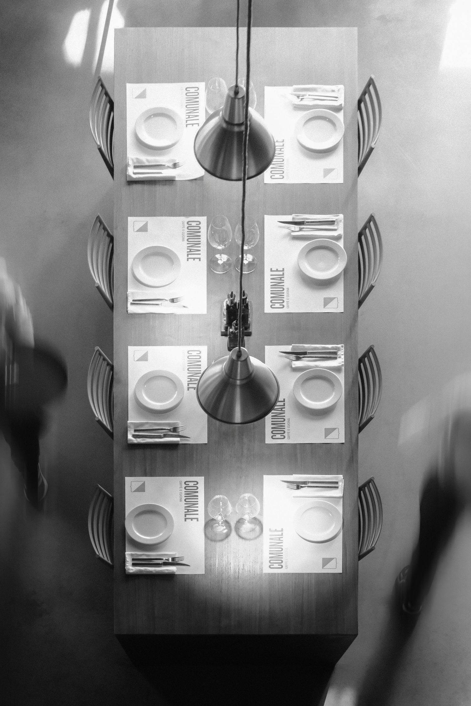 Artistic black and white photograph of dining table at the Comunale restaurant in Belgrade.