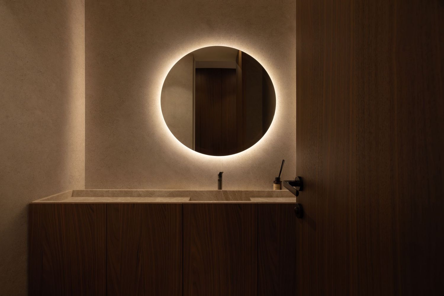 A dramatic total solar eclipse creates a glowing ring of light in a dark brown sky above architectural columns by Studio Fluid.