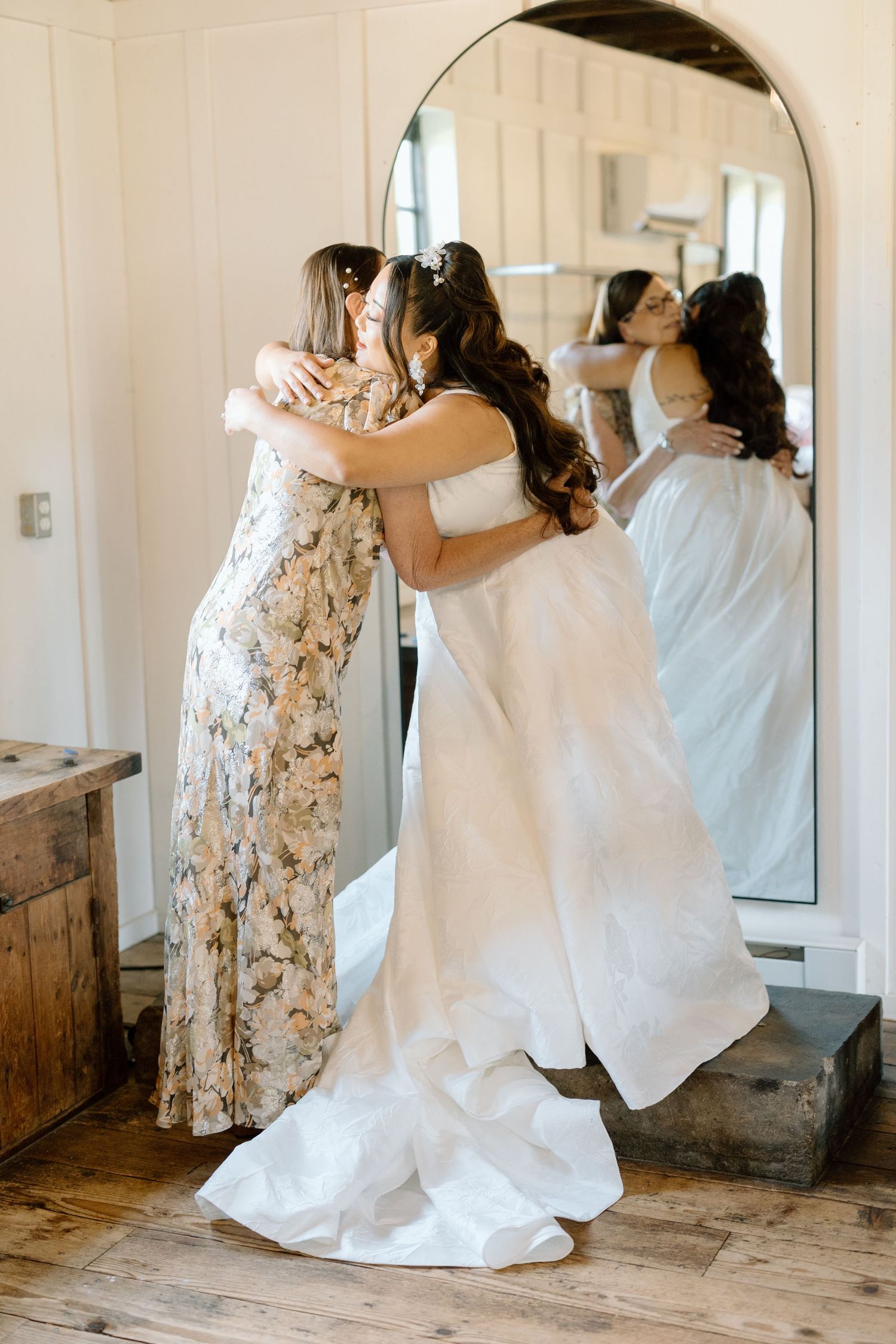 A series of candid moments showing a mother and daughter embracing in a rustic indoor setting.