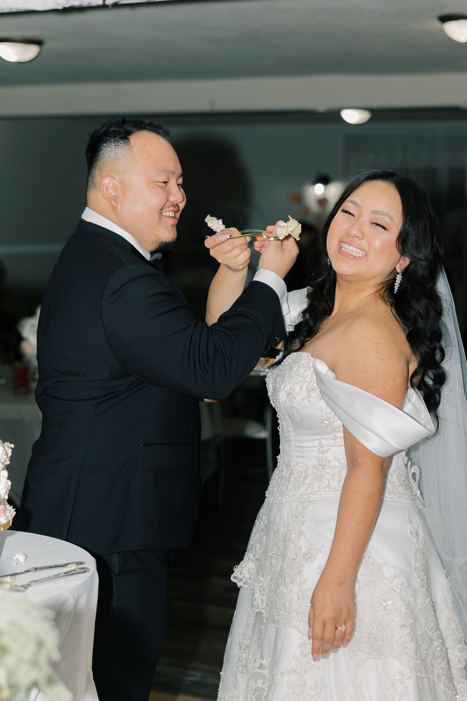 A series of candid wedding reception moments showing a couple sharing cake during their wedding celebration.