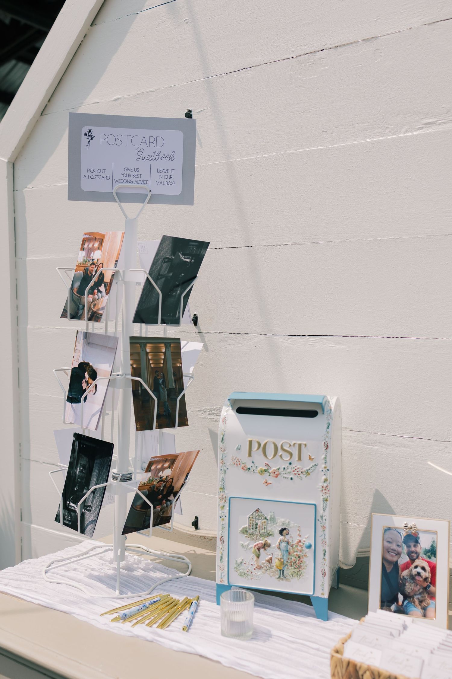 White display setup with postcards and stationery items arranged on a table.