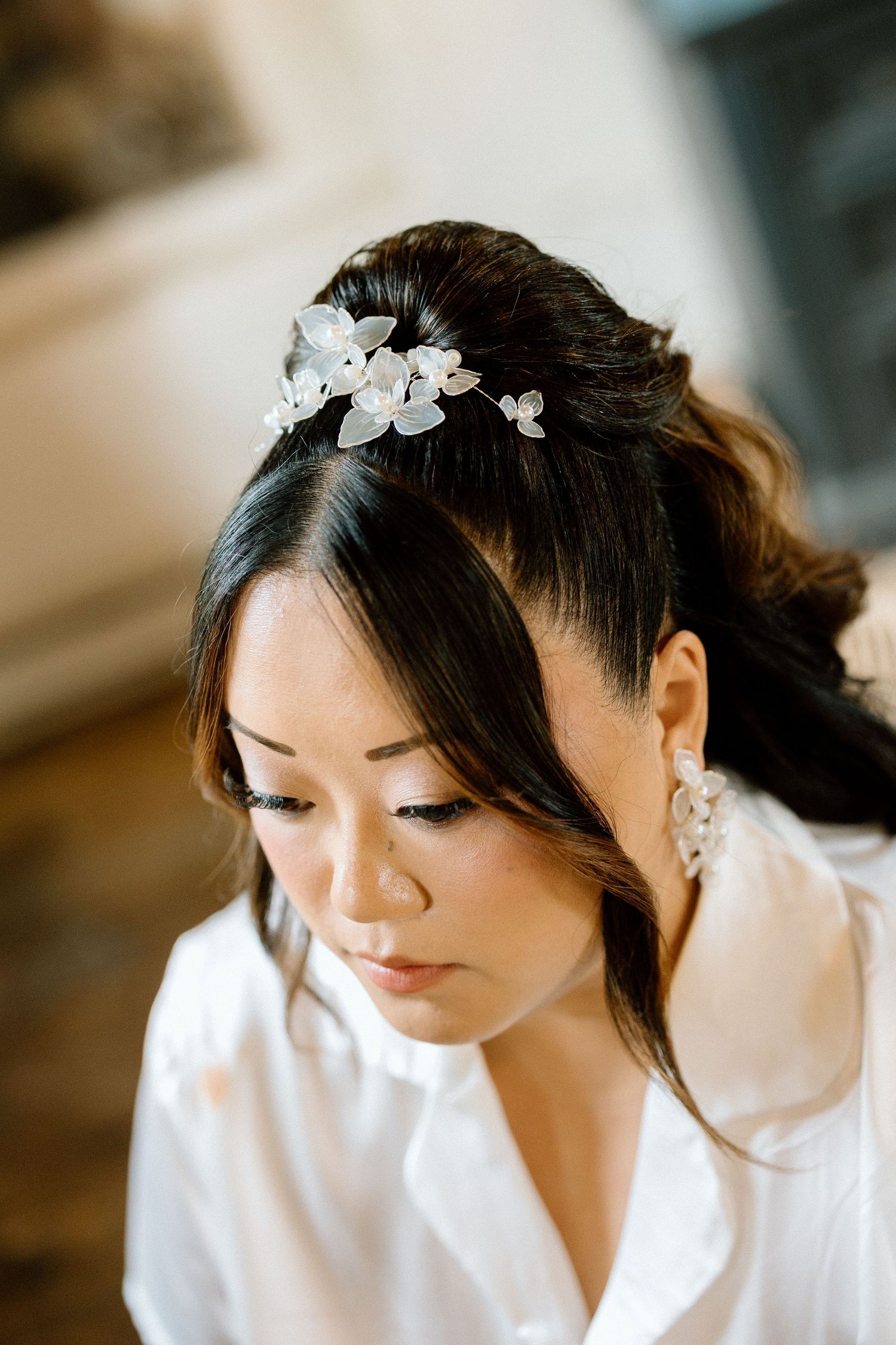 Elegant bridal hair accessories and delicate floral details for wedding day preparation.
