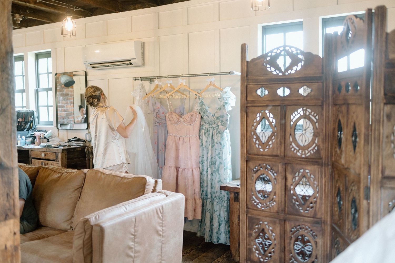 Rustic interior hallway with vintage wooden doors featuring ornate glass panels and decorative details.