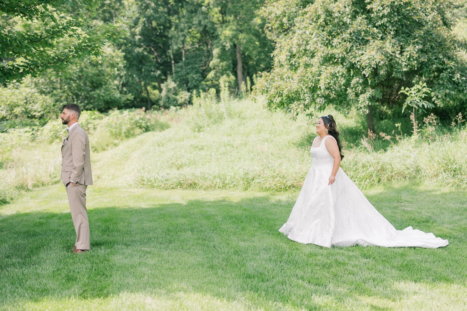 Wedding couple portraits in a lush green garden setting.
