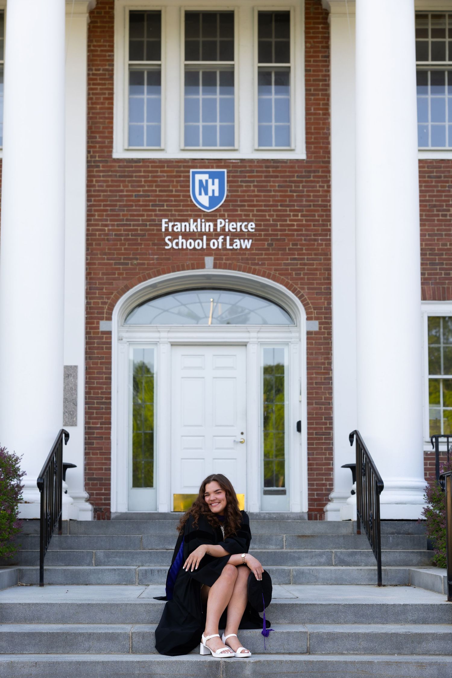 A series of photos showing someone posing on the steps of Franklin Pierce School of Law's brick building entrance.