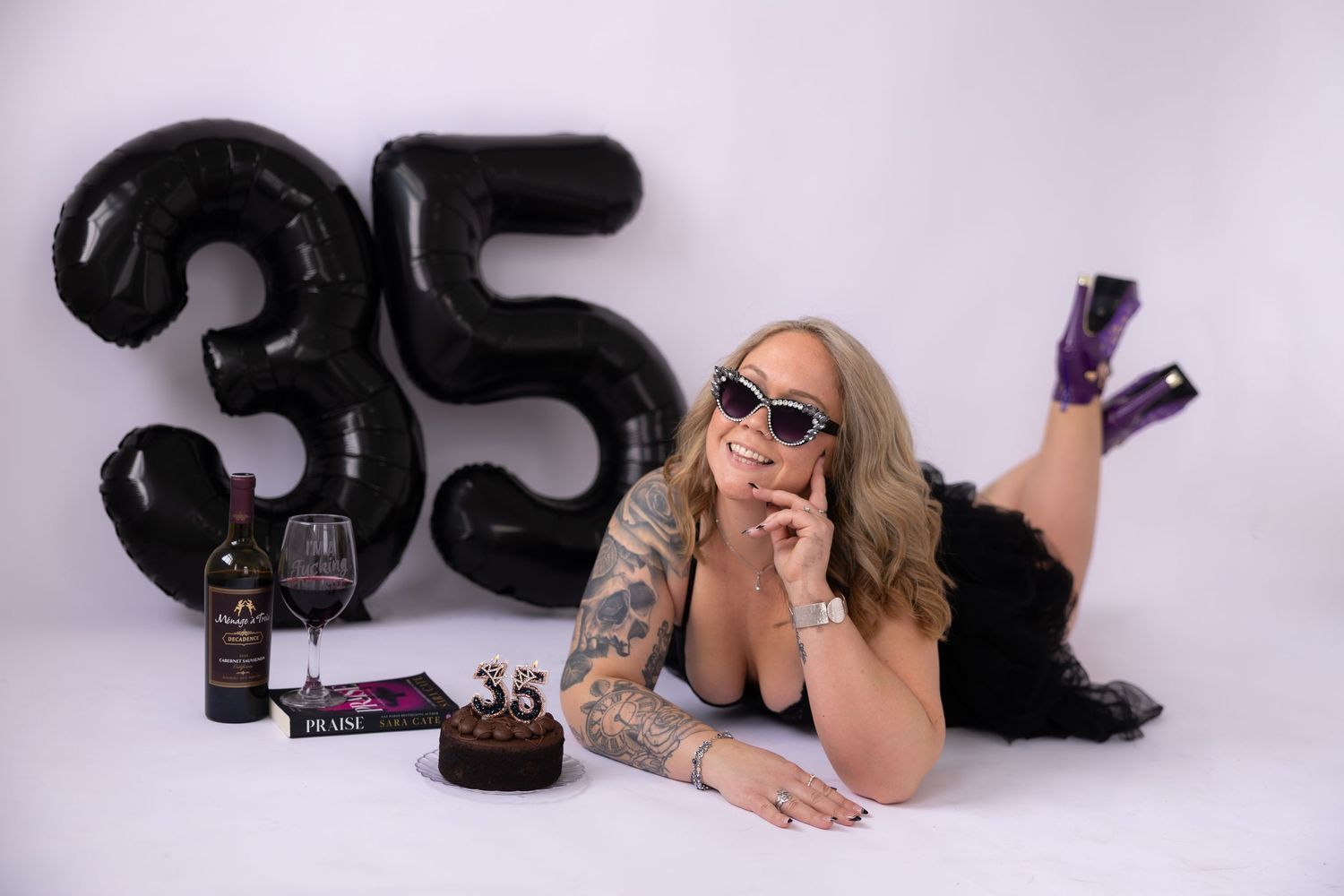 A series of five black and white fashion photographs showing poses with boxing gloves and sunglasses against a white backdrop.