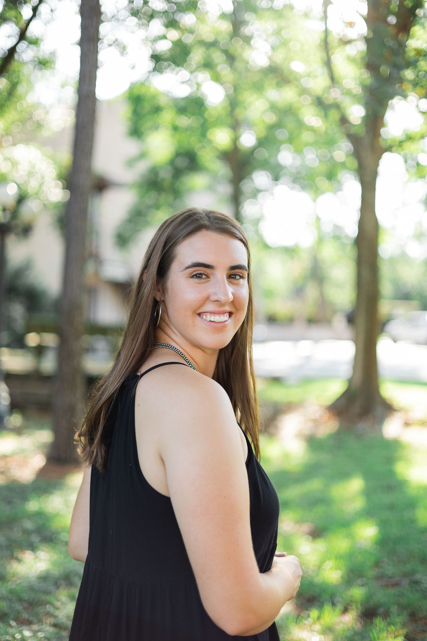 A professional headshot of Autumn Elizabeth, showcasing her approachable and confident demeanor. This photograph highlig