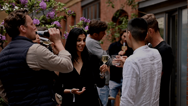 People networking at a reception at a business dinner.